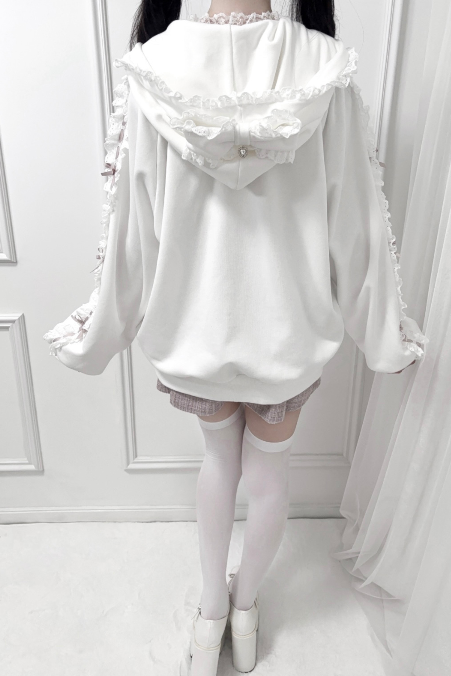 Nekura ribbon ruffle hooded parka