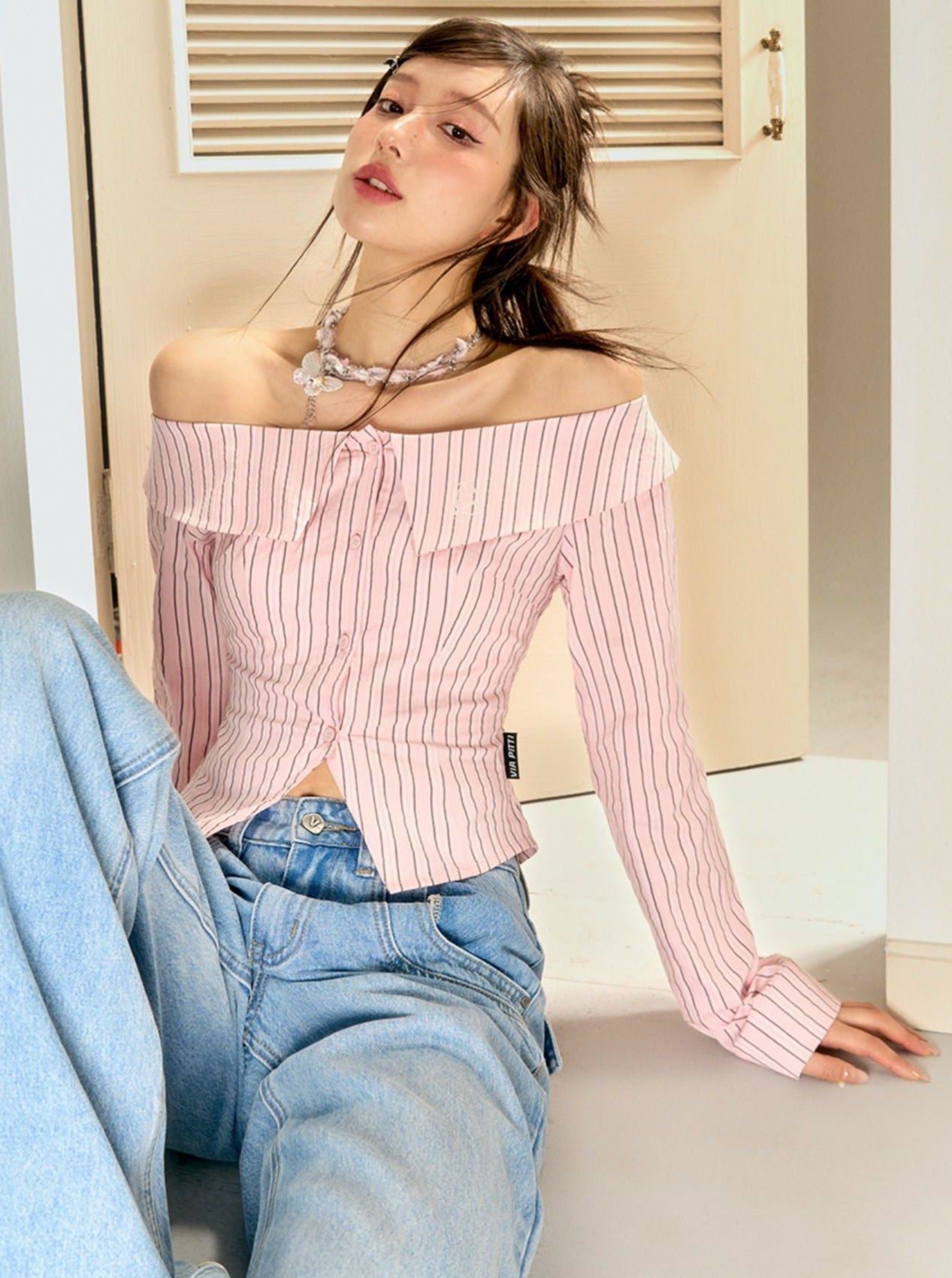 Off -shoulder striped shirt