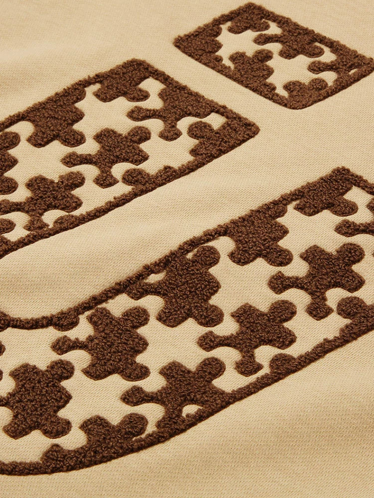 トレンディロゴモードブラウンオーバートレーナー