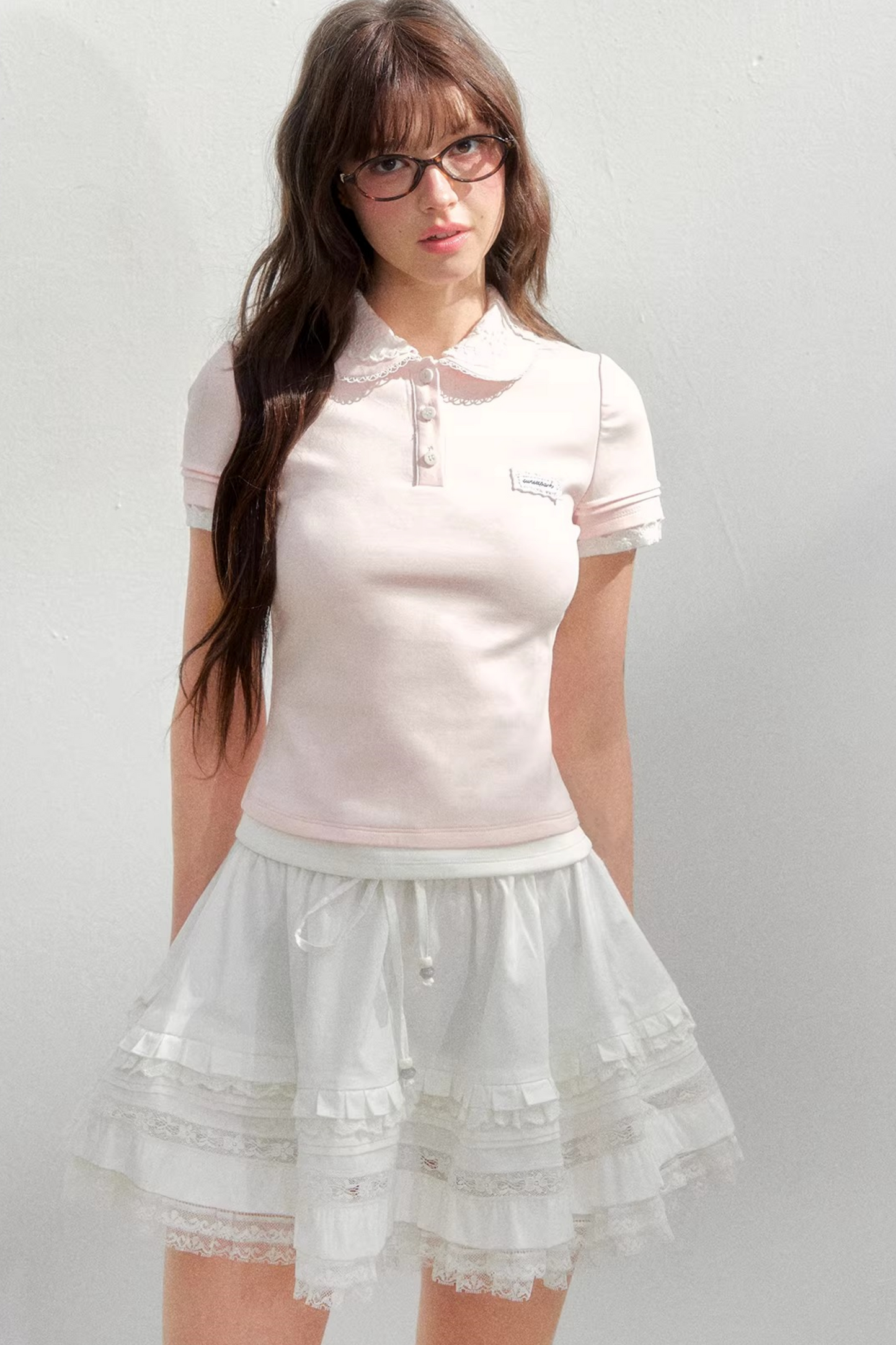 Blusa rosa con colletto ricamato