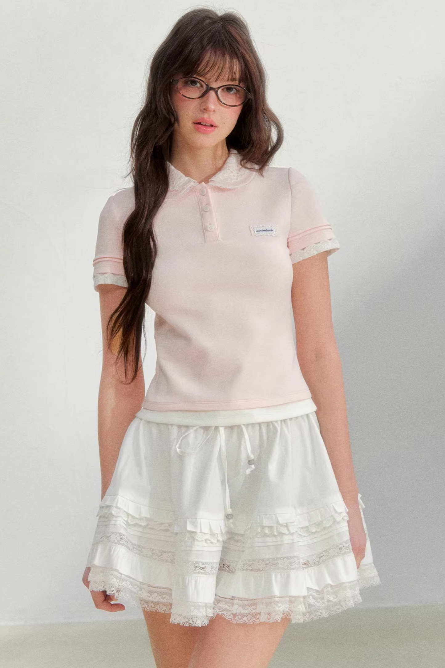 Blusa rosa con colletto ricamato