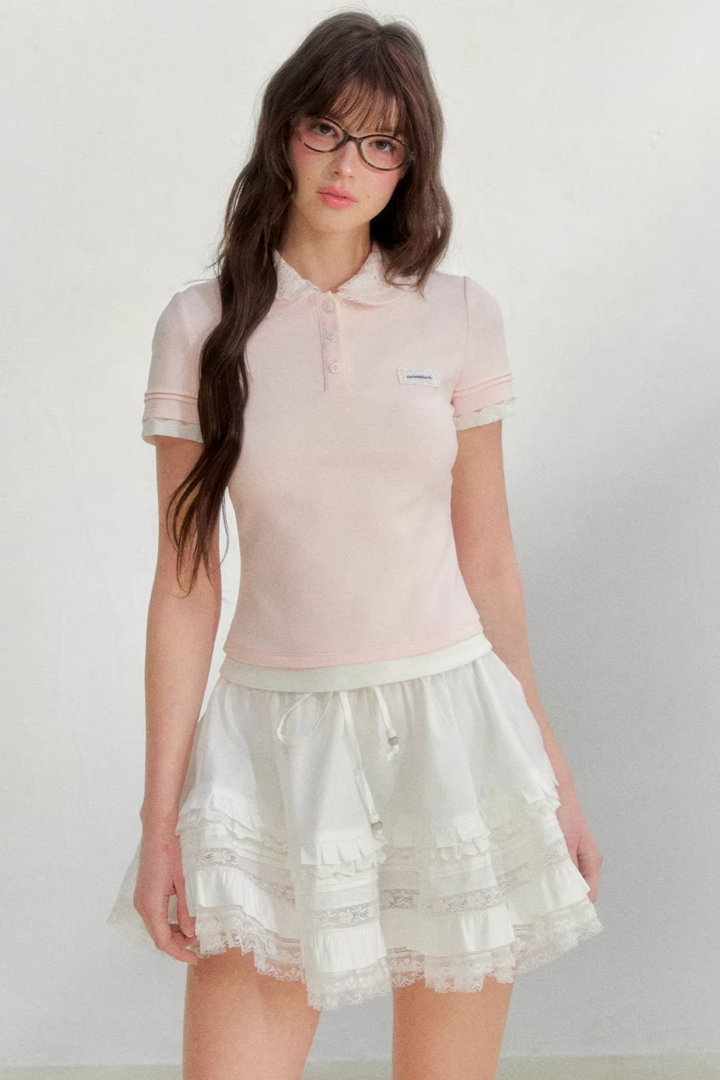 Blusa rosa con colletto ricamato