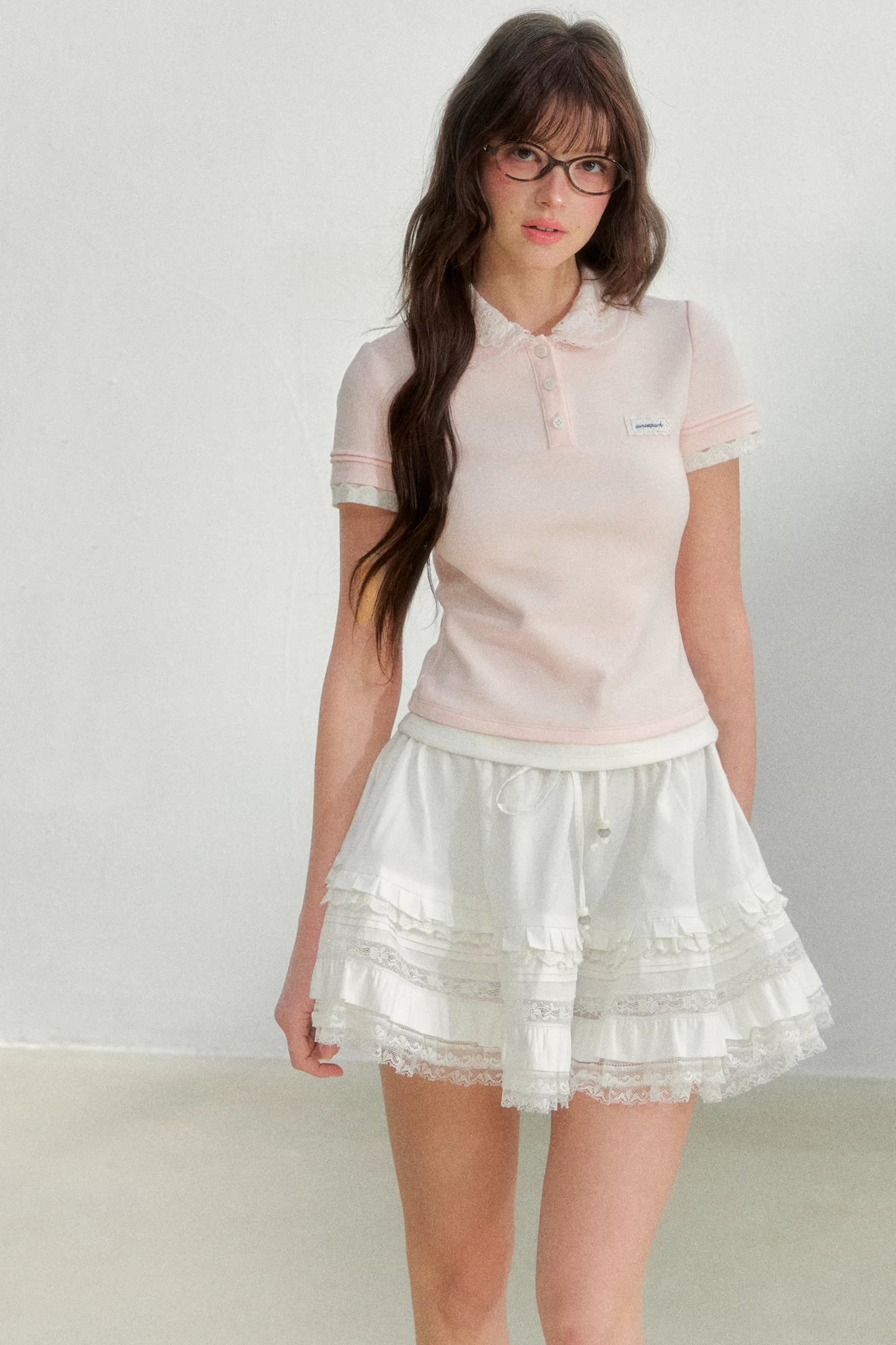 Blusa rosa con colletto ricamato
