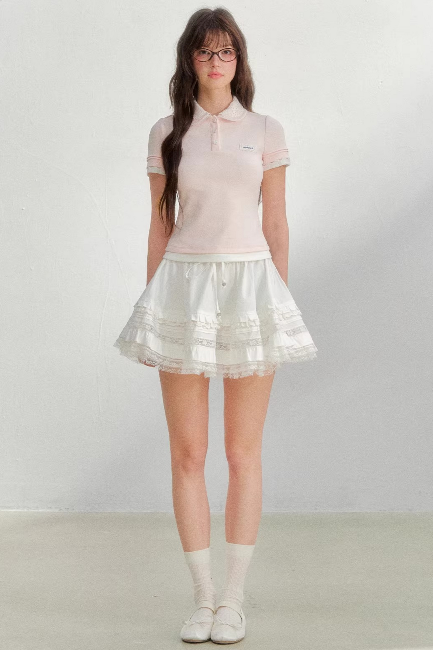 Blusa rosa con colletto ricamato