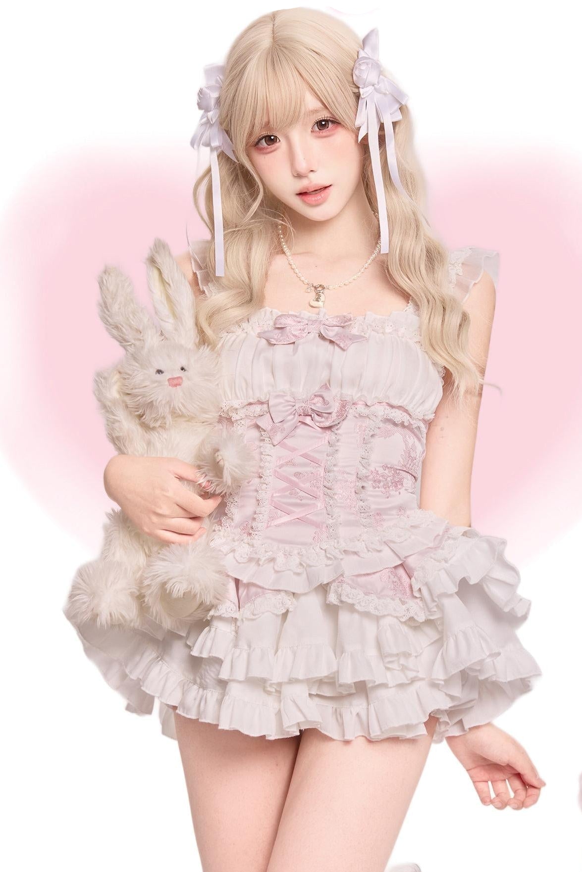Top rosa elegante + gonna a balze bianca