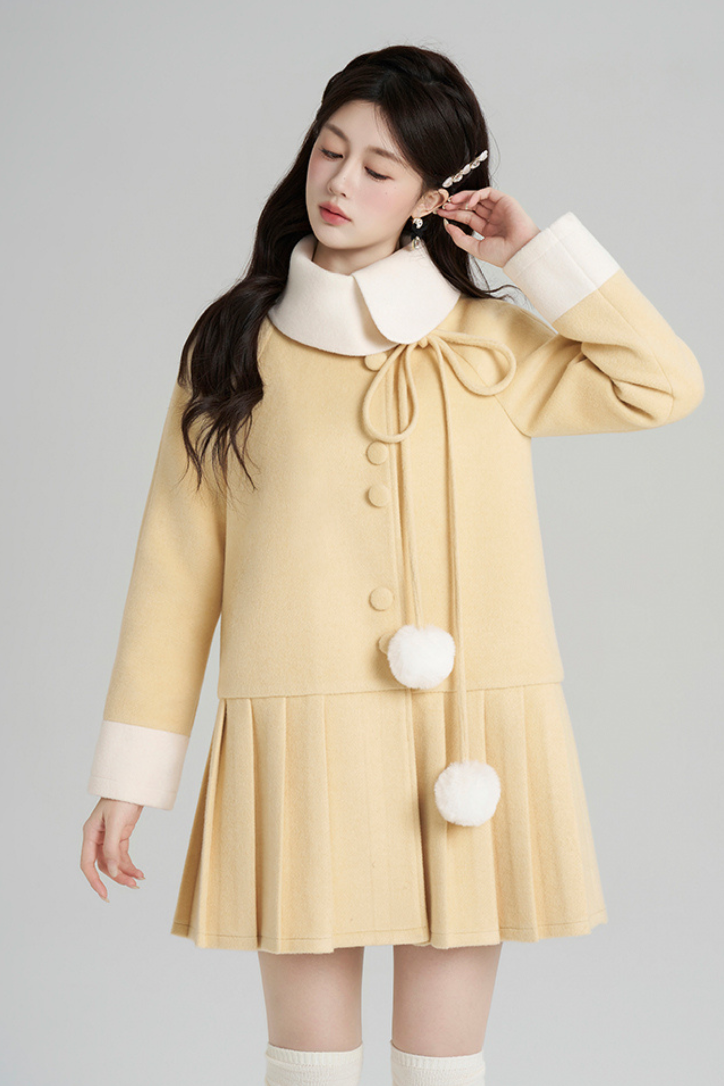 イエロープリーツウールコート