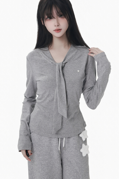 マルチカラーボタンリボントップス