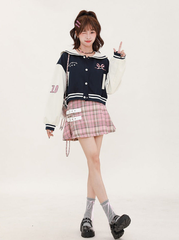 Navy-colored short stadium jacket + checked skirt