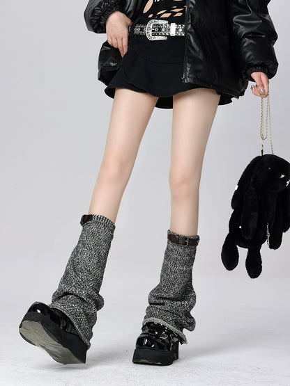 Dark leather buckle leg warmers