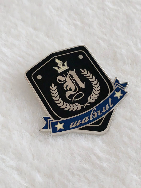 College black trench coat + metal badge + embroidered ribbon shirt + pleated skirt