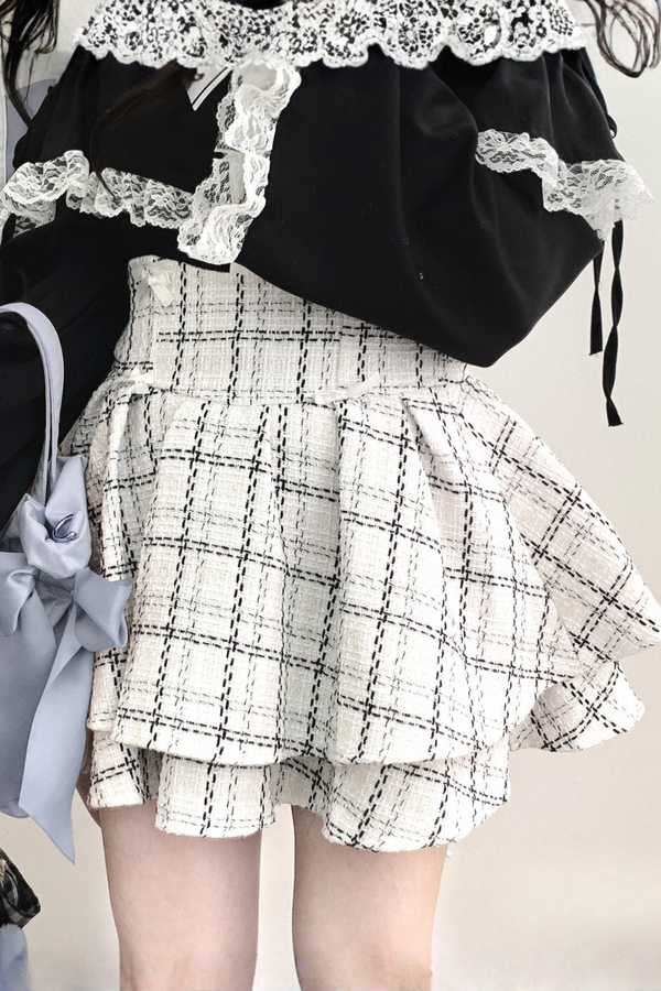 Falda de tweed a cuadros con encaje abullonado