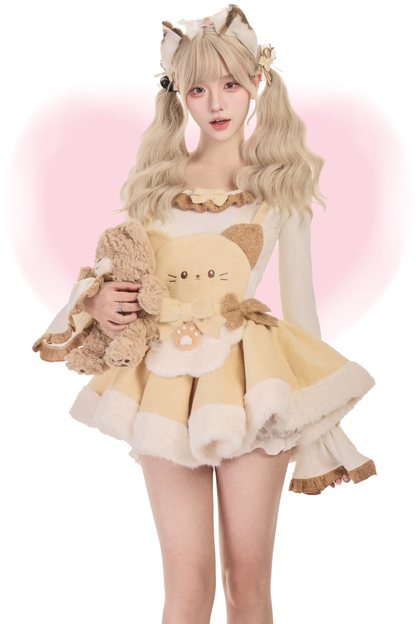 Knit top + kitten suspender skirt with brooch + cape