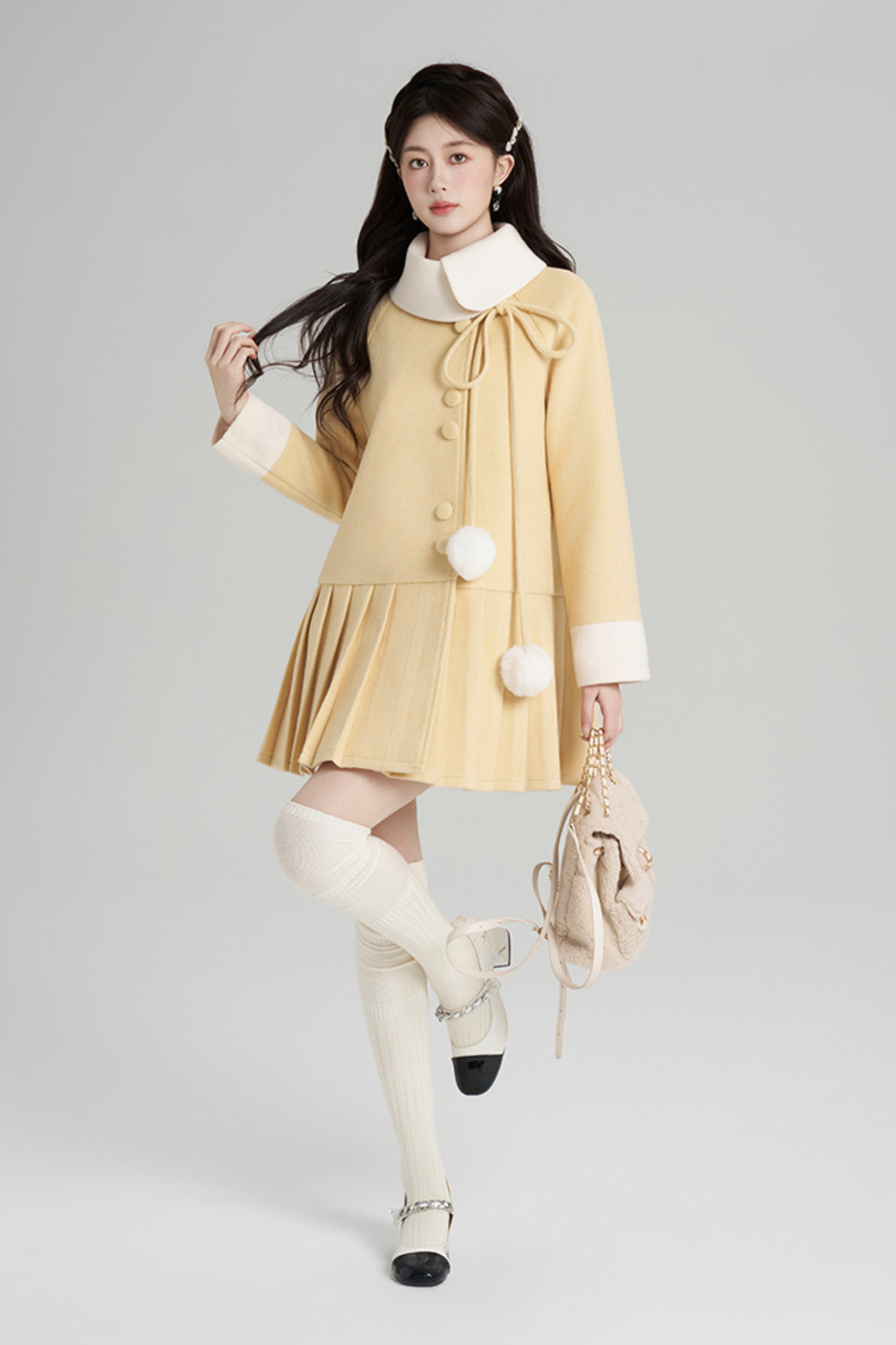 イエロープリーツウールコート