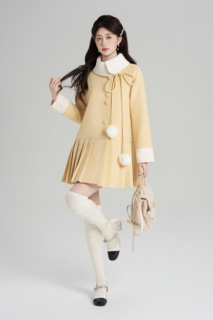 イエロープリーツウールコート