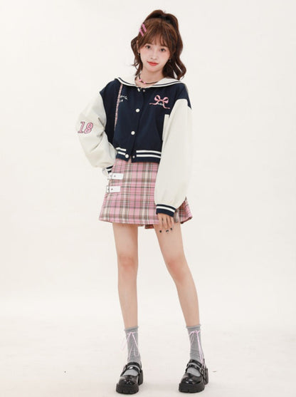 Navy-colored short stadium jacket + checked skirt