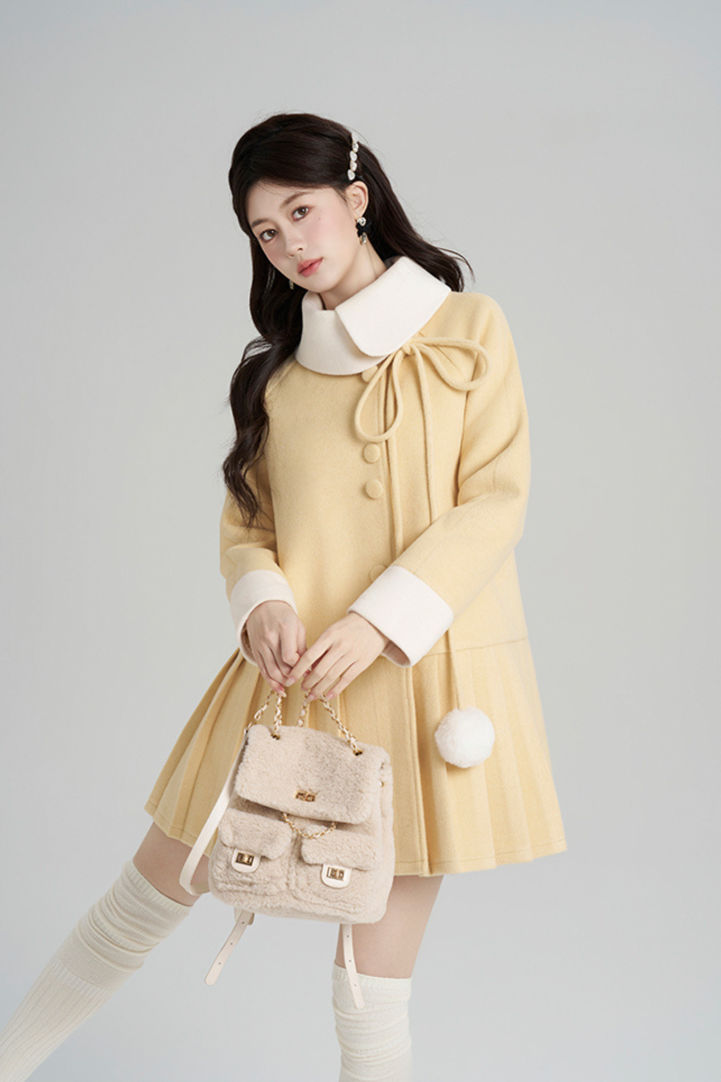 イエロープリーツウールコート