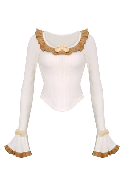 Knit top + kitten suspender skirt with brooch + cape