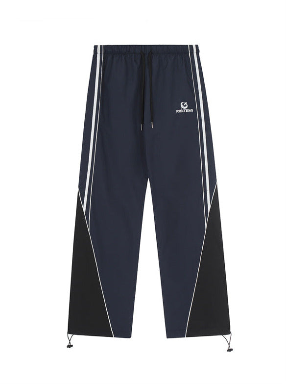 Straight sports pants with side stripe design