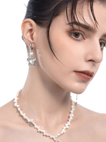 Boucles d'oreilles avec pendentif en forme de cœur en perle