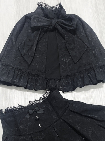 Dark cape + flared skirt
