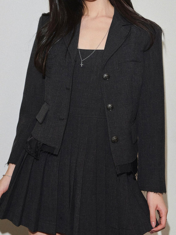 Dark-colored jacket + pleated camisole dress