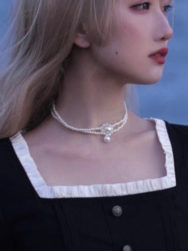 Black square collar French retro dress + waist ribbon + black ribbon catsuit + pearl necklace [Reserved Item].