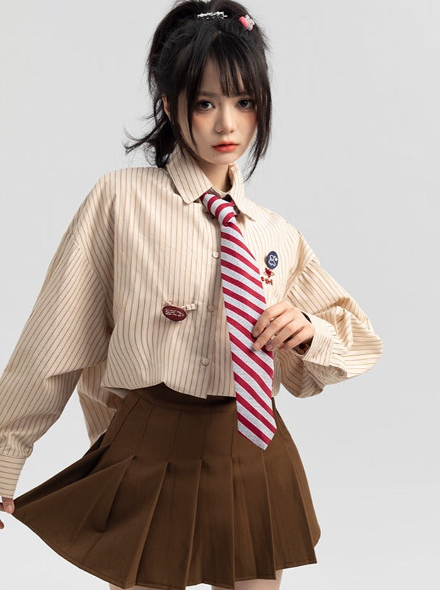 Striped tie shirt + pleated skirt