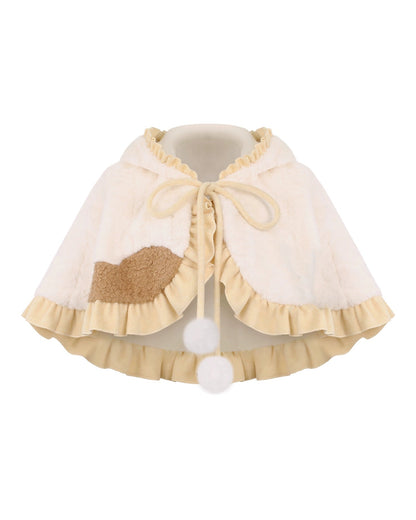 Knit top + kitten suspender skirt with brooch + cape