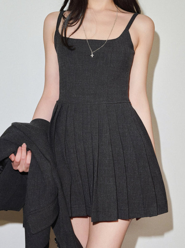 Dark-colored jacket + pleated camisole dress