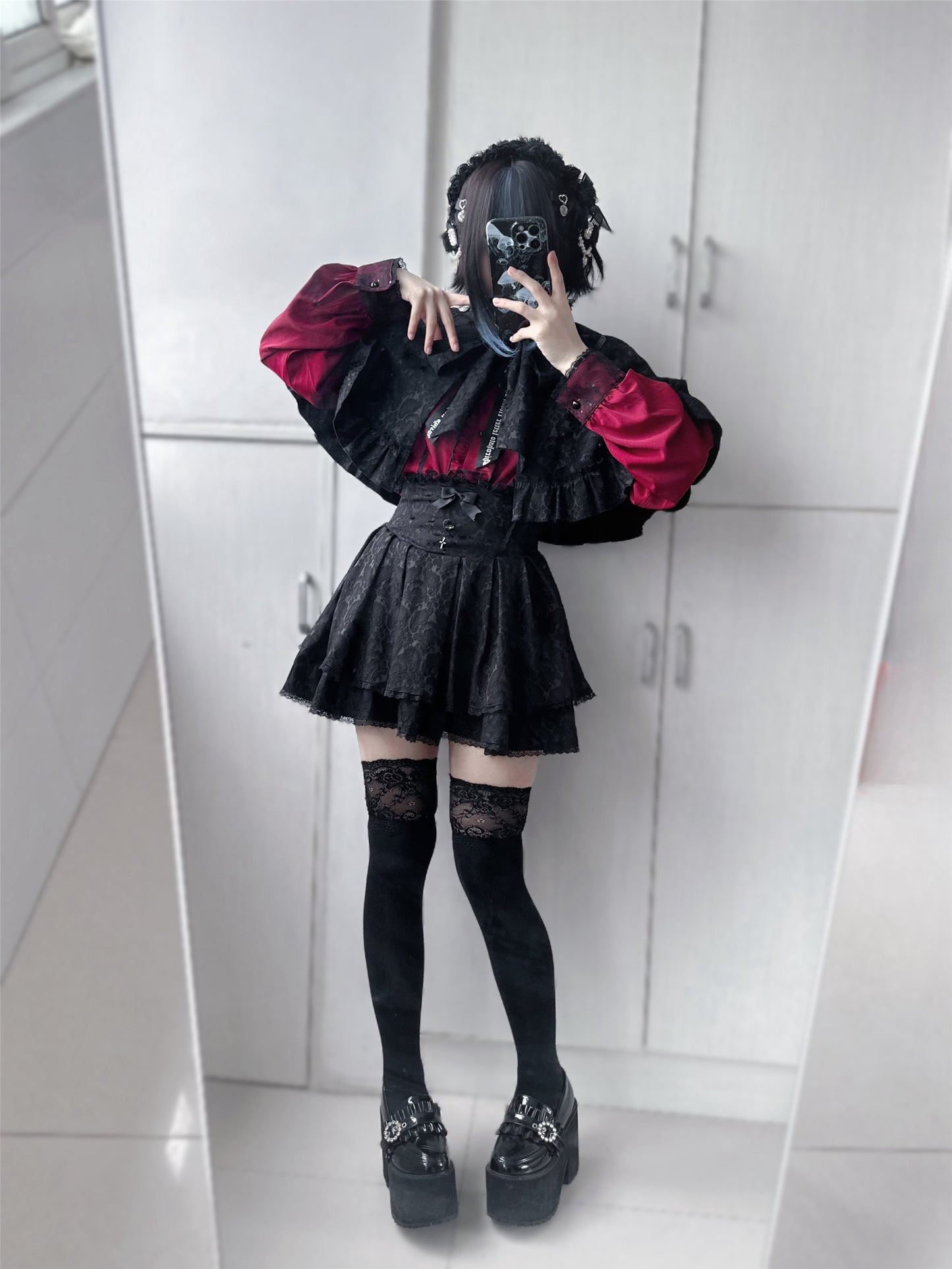Dark cape + flared skirt