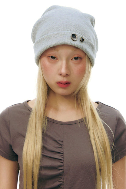 Bonnet à boutons en tricot gaufré