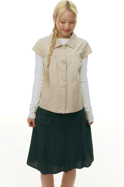 Top con colletto da bambola e maniche a volant