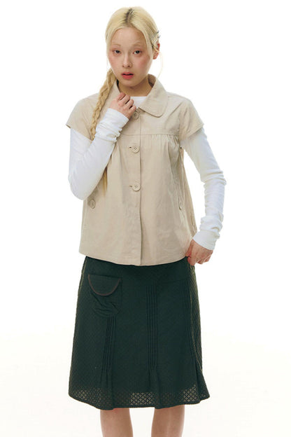 Top con colletto da bambola e maniche a volant