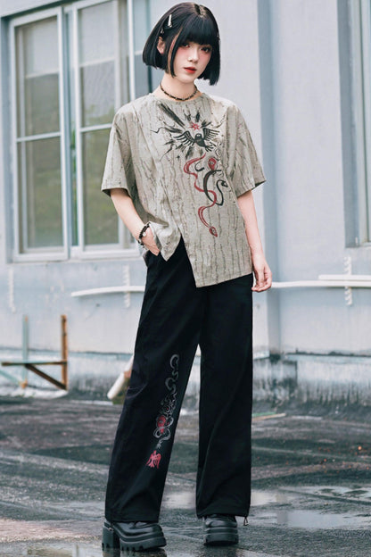 Schwarze Hose mit Schlangen- und China-Stickerei