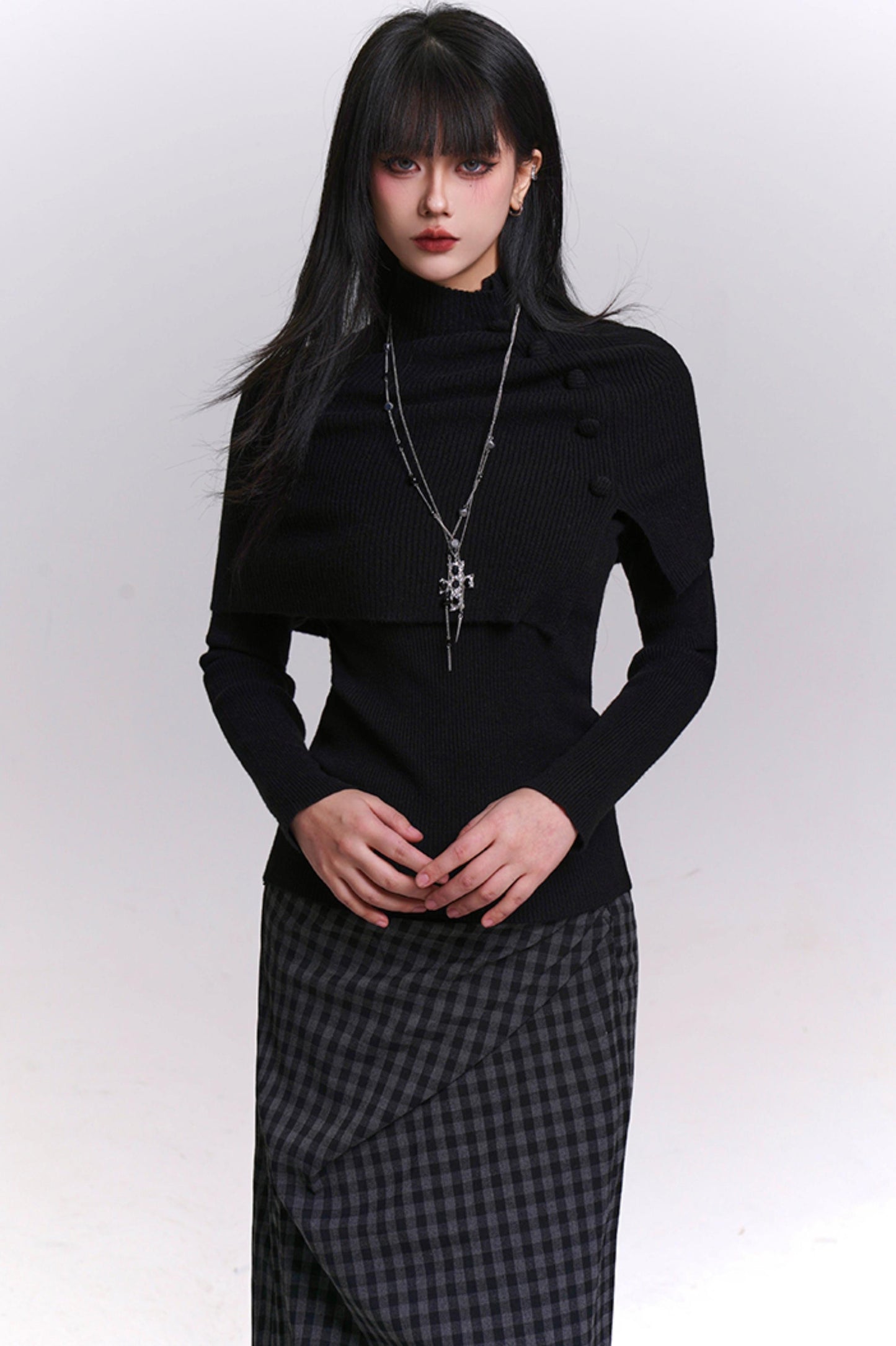 アトモスフェリックケープデザインニットトップ