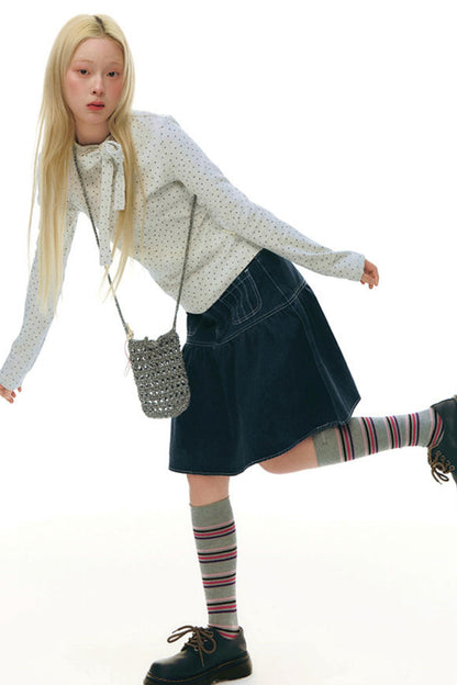 Top aderente con collo alto a stella