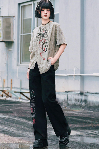 Schwarze Hose mit Schlangen- und China-Stickerei