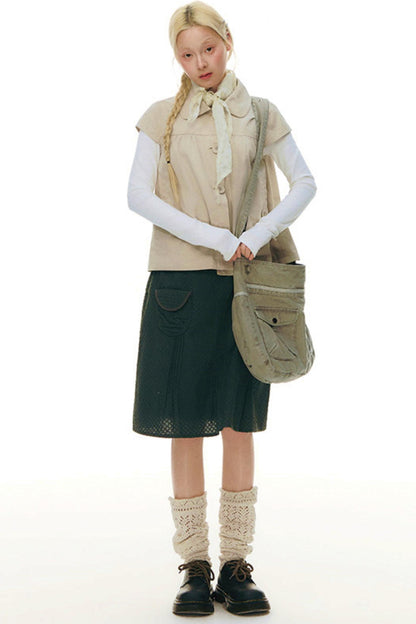 Top con colletto da bambola e maniche a volant