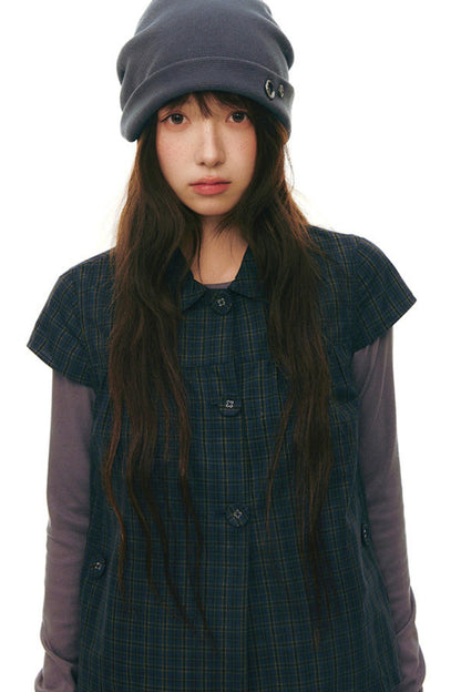 Top con colletto da bambola e maniche a volant