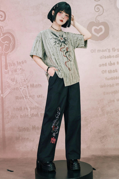 Schwarze Hose mit Schlangen- und China-Stickerei