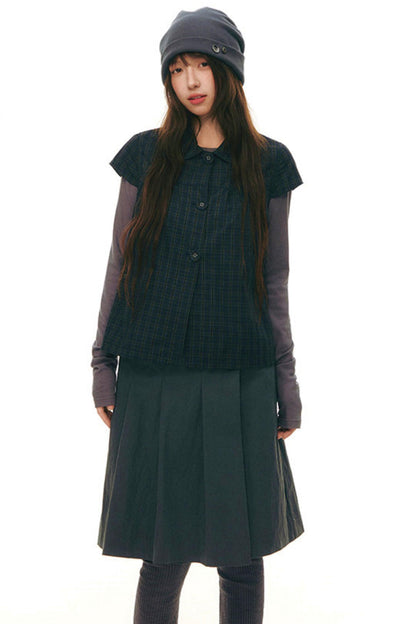 Top con colletto da bambola e maniche a volant