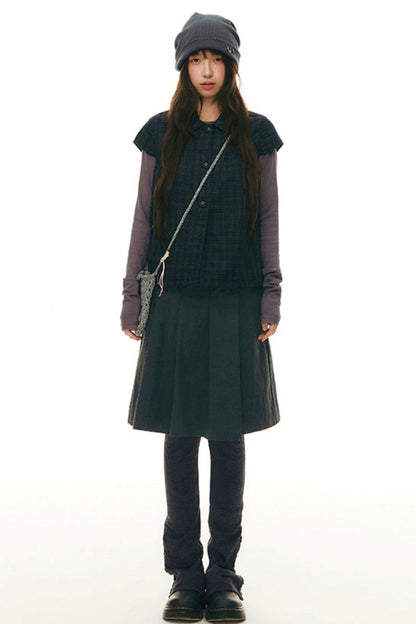 Top con colletto da bambola e maniche a volant