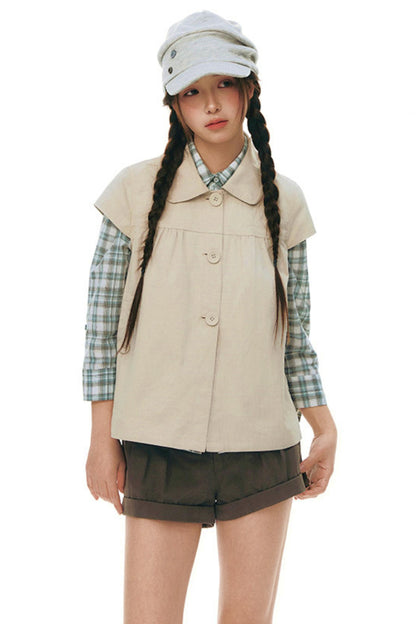 Top con colletto da bambola e maniche a volant