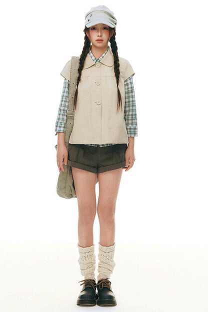 Top con colletto da bambola e maniche a volant