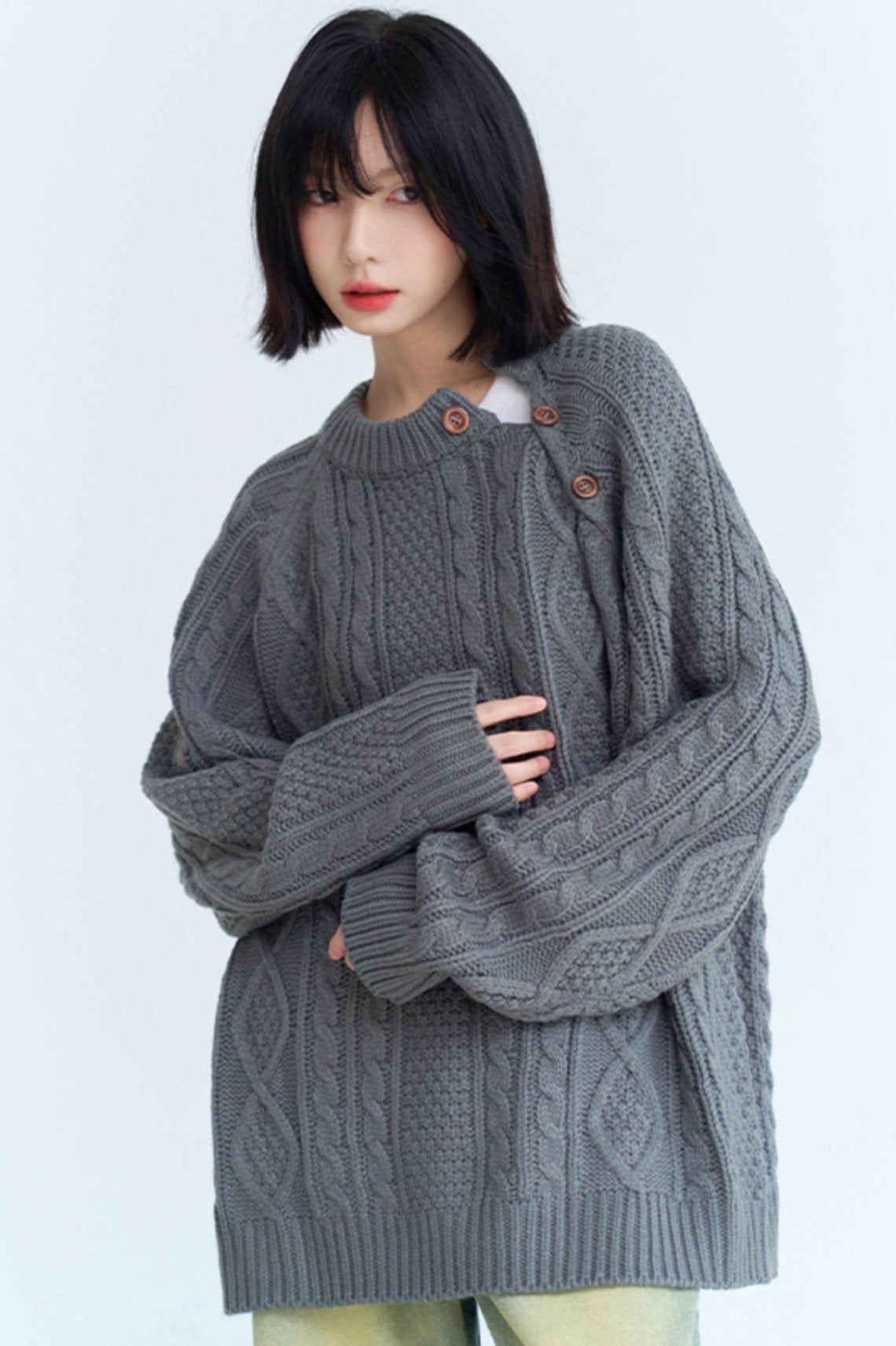 Twist design side button loose sweater