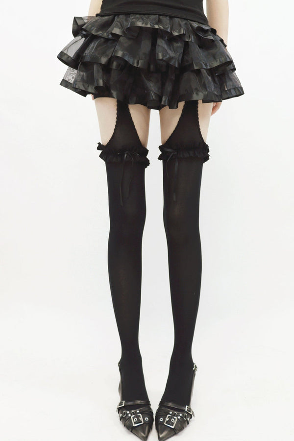 Leggings con tirantes, abertura y lazo