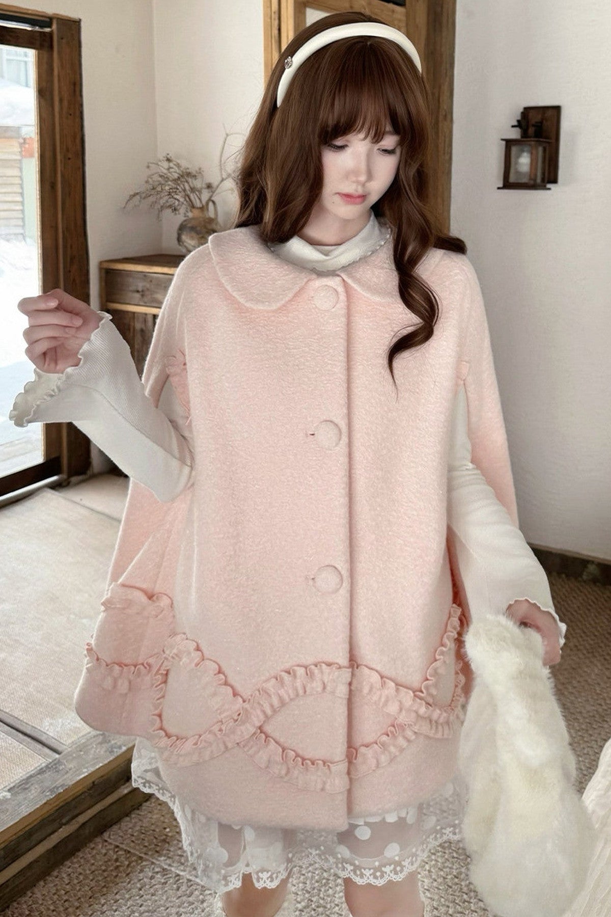Cappotto di lana rosa con fragole