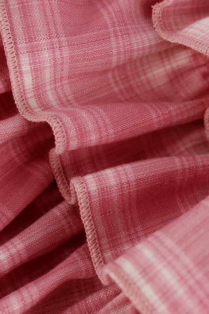 Rosa Oberteil im College-Stil + Stufenrock mit Schleife