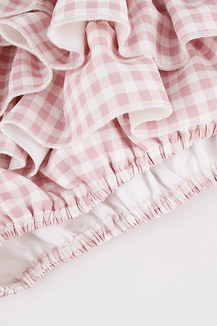 Top rosa femminile + gonna a balze a quadri