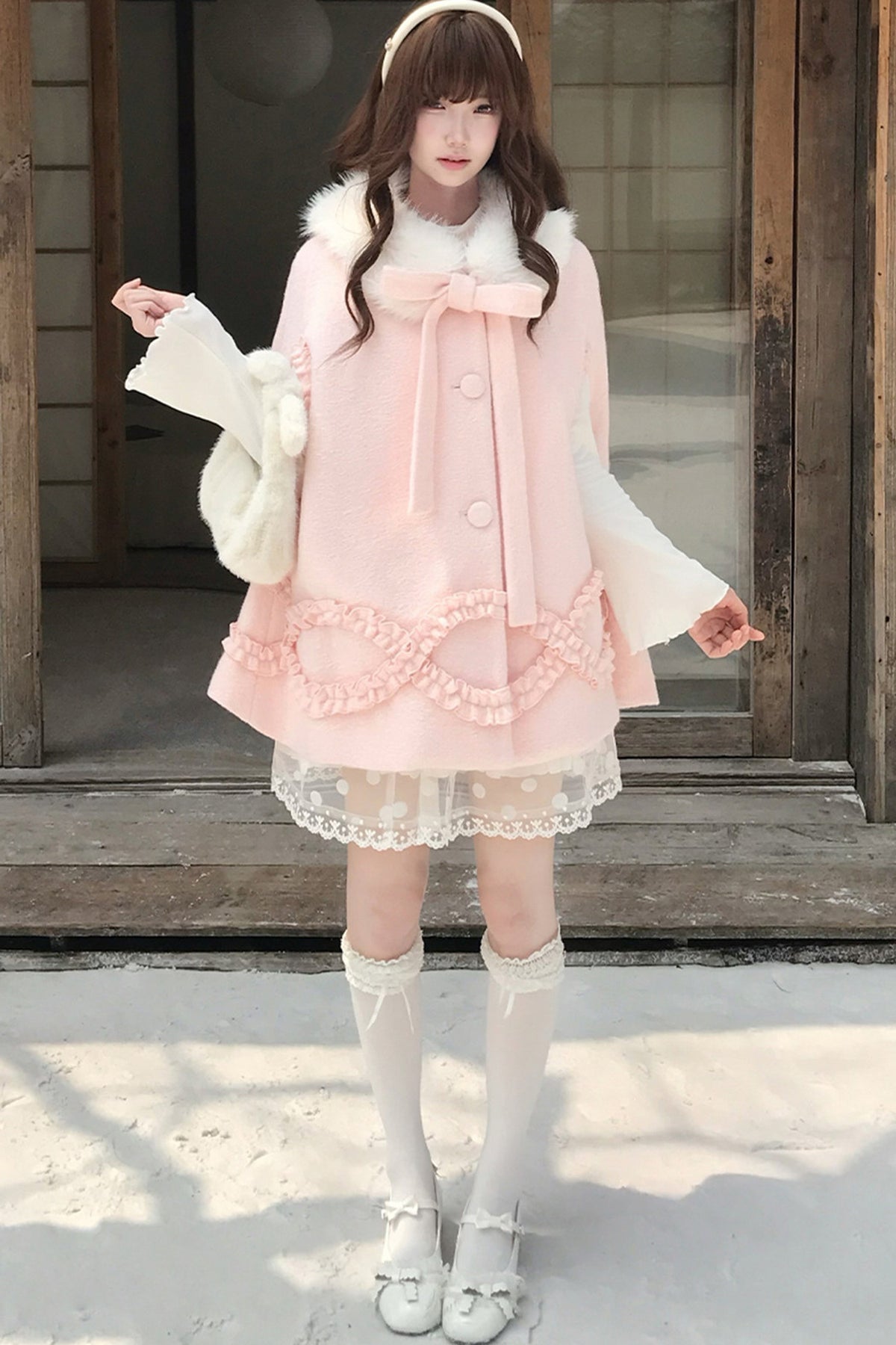 Cappotto di lana rosa con fragole